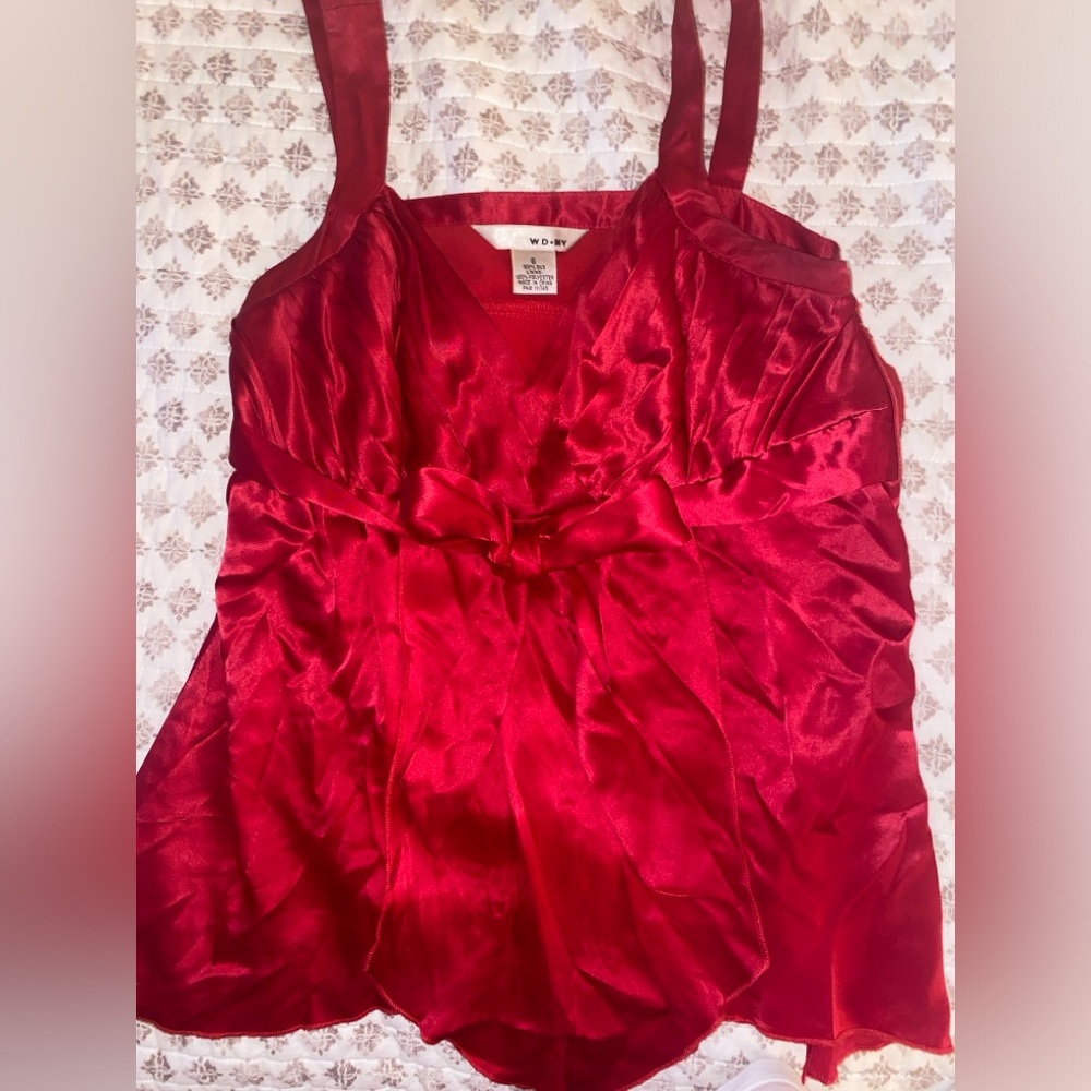 Holiday red 100% silk top. Side zips . Gorgeous dressy top runs small . Size 6
